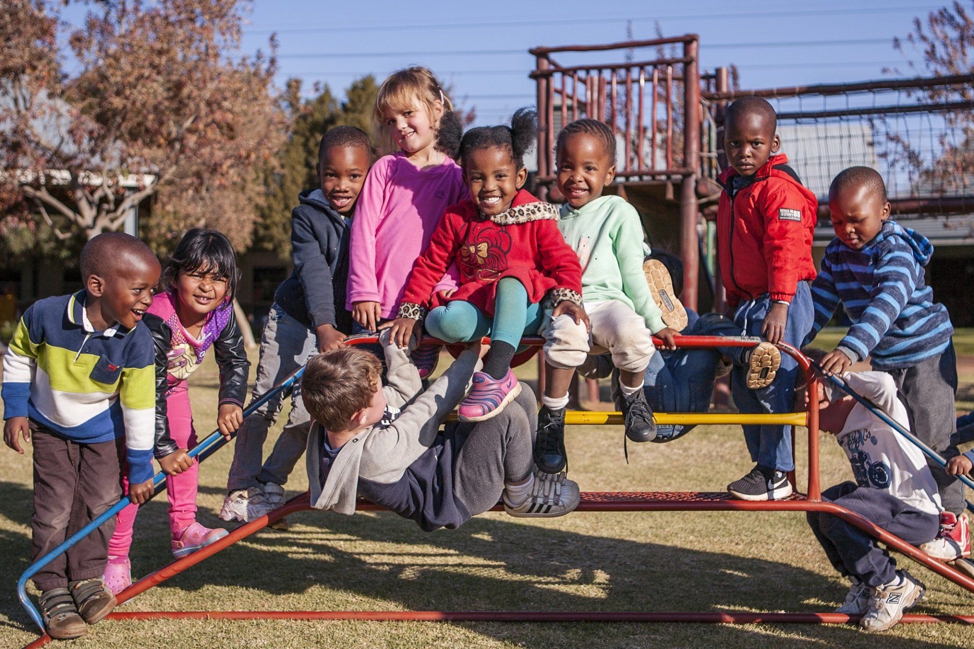 A group of children are playing on a playground.