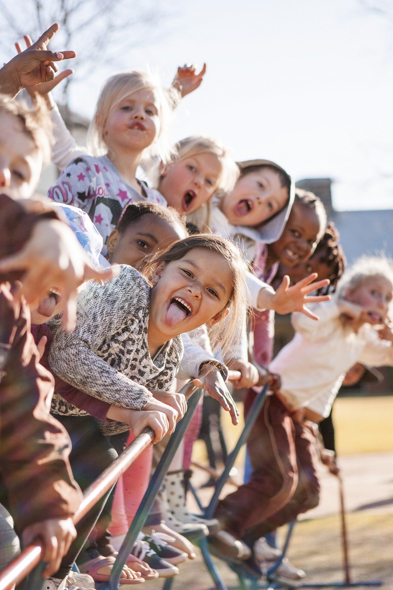A group of children are playing on a playground.