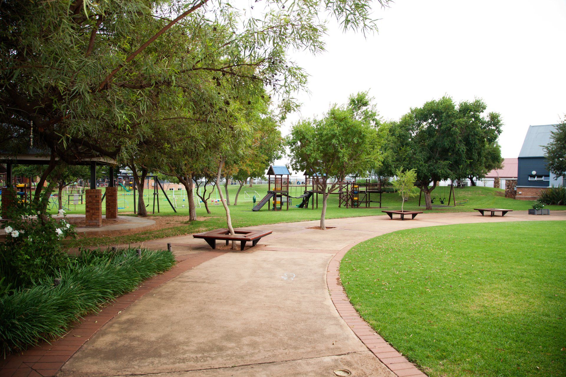 A park with a picnic table in the middle of it