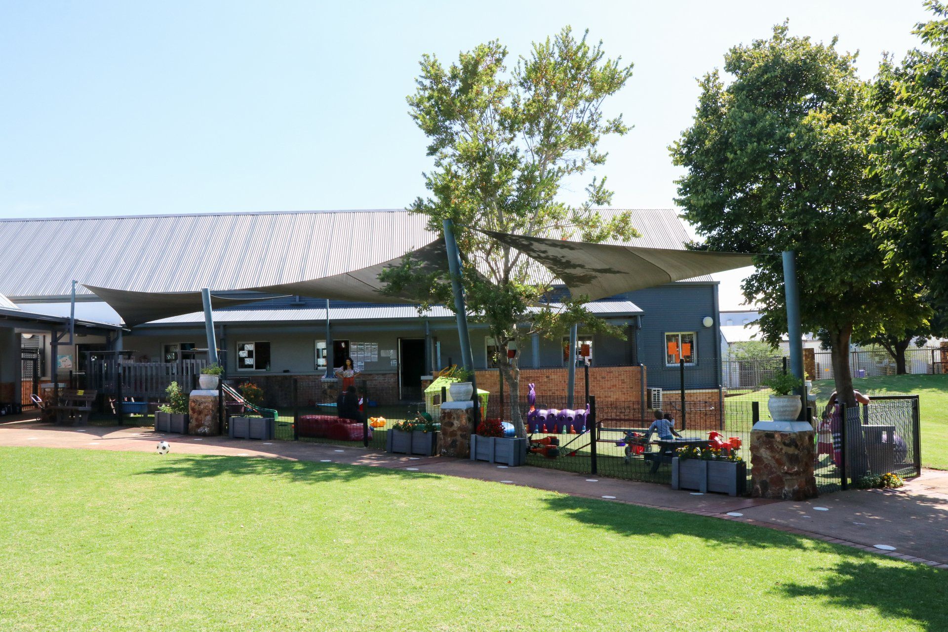 A large building with a large lawn in front of it