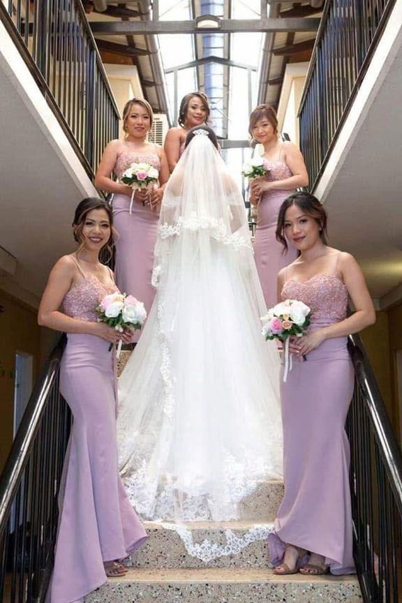 A Bride and Her Bridesmaids Are Posing for a Picture on the Stairs — Eternal Weddings & Couture In Woolner, NT