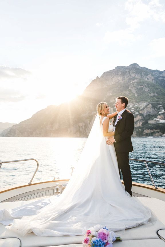 A Bride and Groom Are Posing for a Picture on a Boat in the Ocean — Eternal Weddings & Couture In Woolner, NT