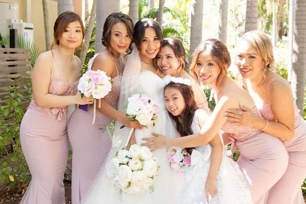A Bride and Her Bridesmaids Are Posing for a Picture — Eternal Weddings & Couture In Woolner, NT