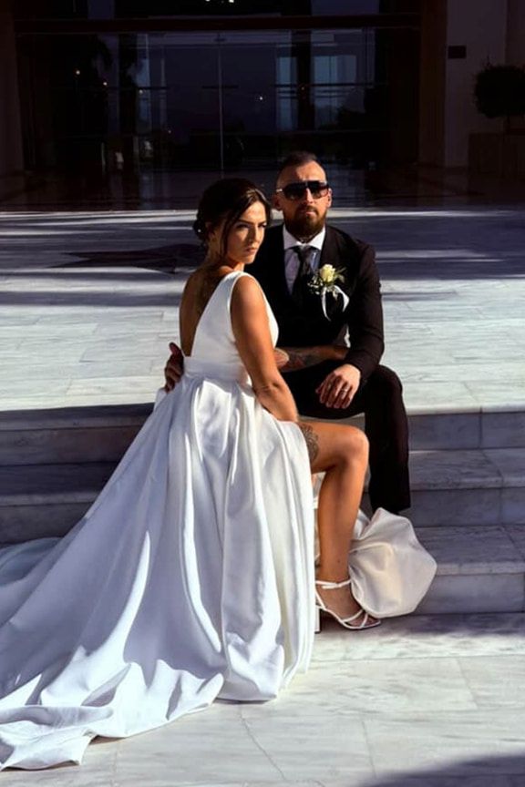 A Bride and Groom And the Bride is Sitting on the Groom 's Lap — Eternal Weddings & Couture In Woolner, NT