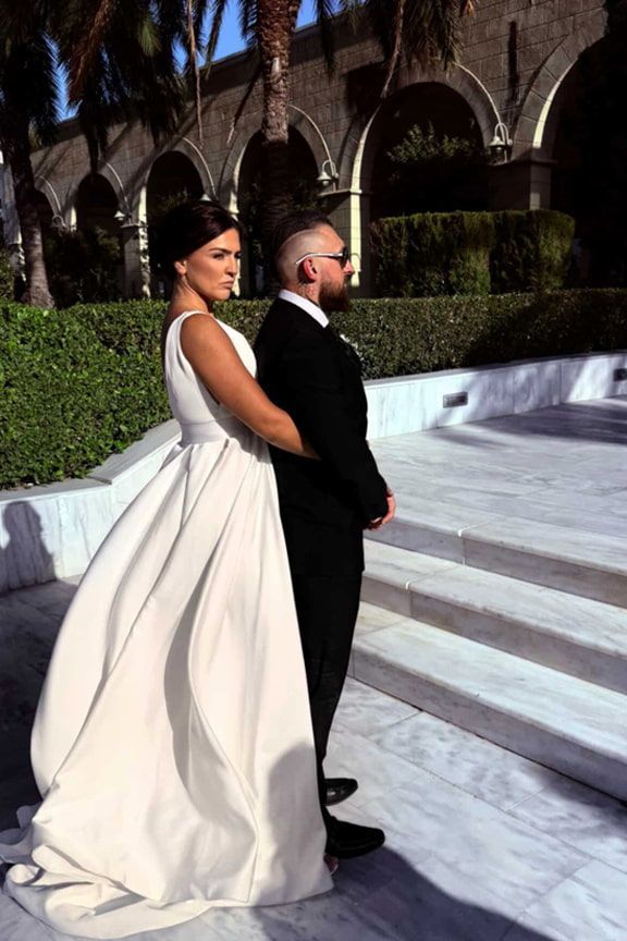 A Bride and Groom Are Standing Next to Each Other on a Set of Stairs — Eternal Weddings & Couture In Woolner, NT
