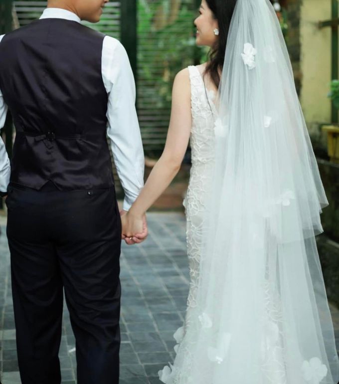 The Bride And Groom Are Holding Hands And Looking At Each Other — Eternal Weddings & Couture In Woolner, NT