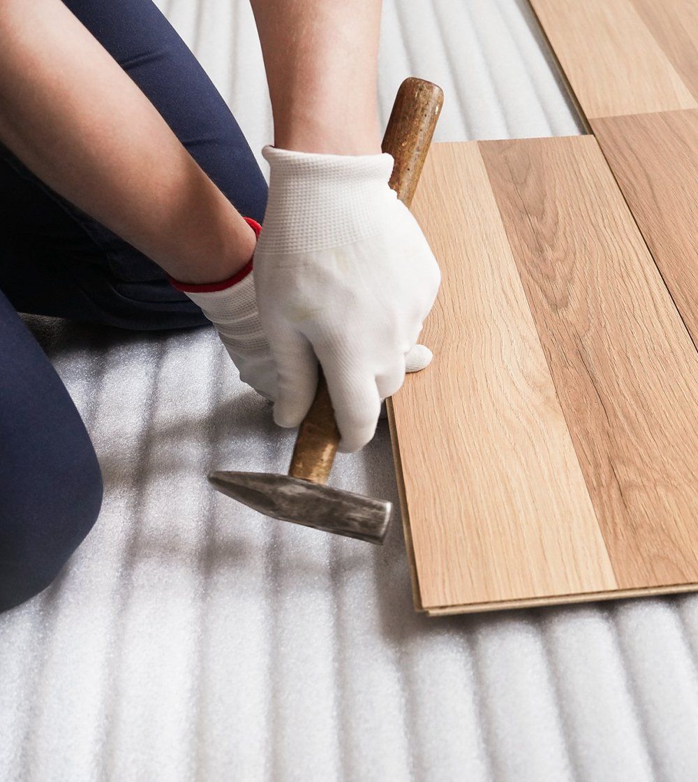 Person Installing Wood Panels — Bergen County, NJ — Alpine Hardwood Flooring