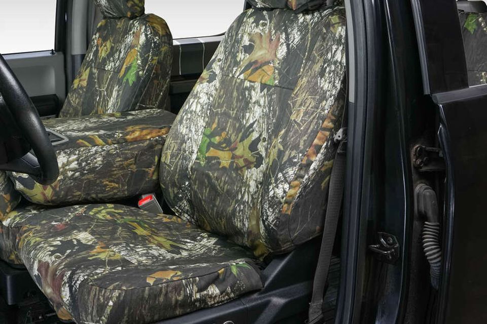 A car with camouflage seat covers on the seats