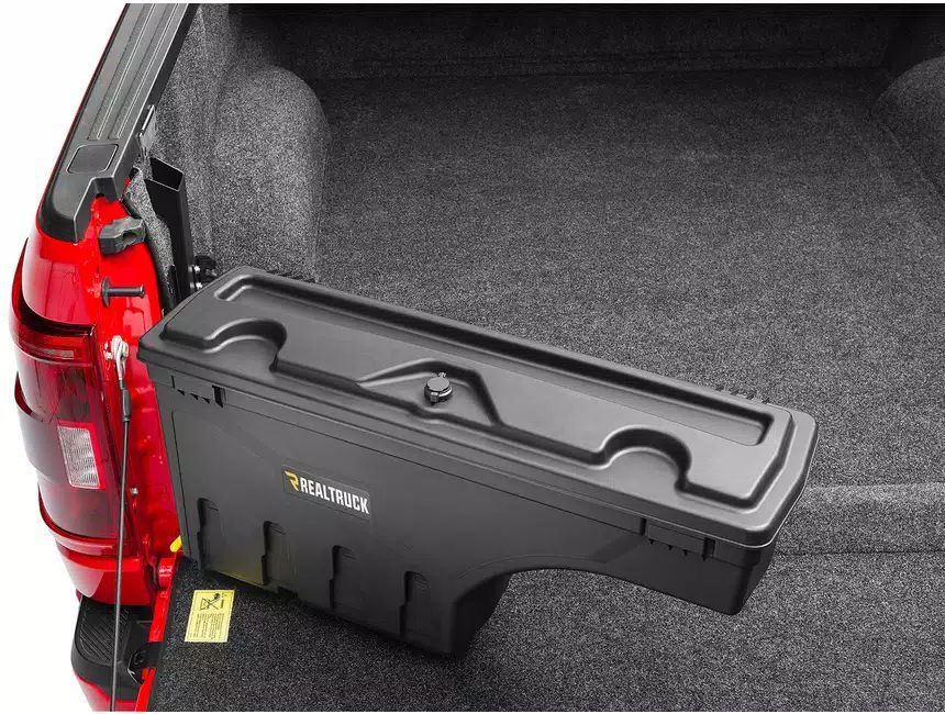 A truck bed with a toolbox attached to it