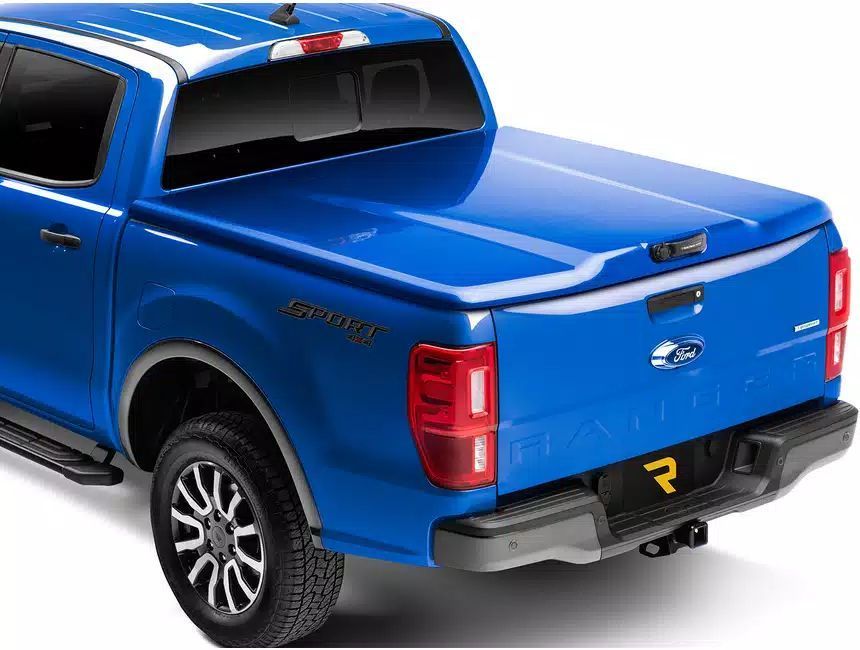 The back end of a blue ford ranger truck