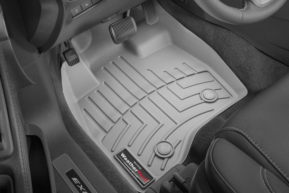 A black and white photo of a car floor mat