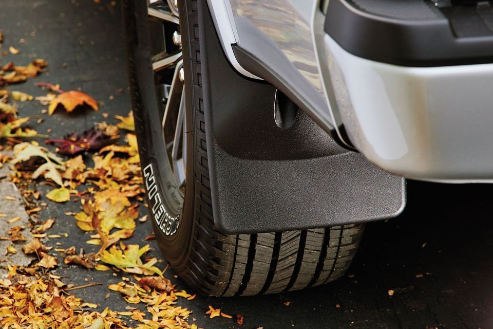 A close up of a car with mud flaps on it