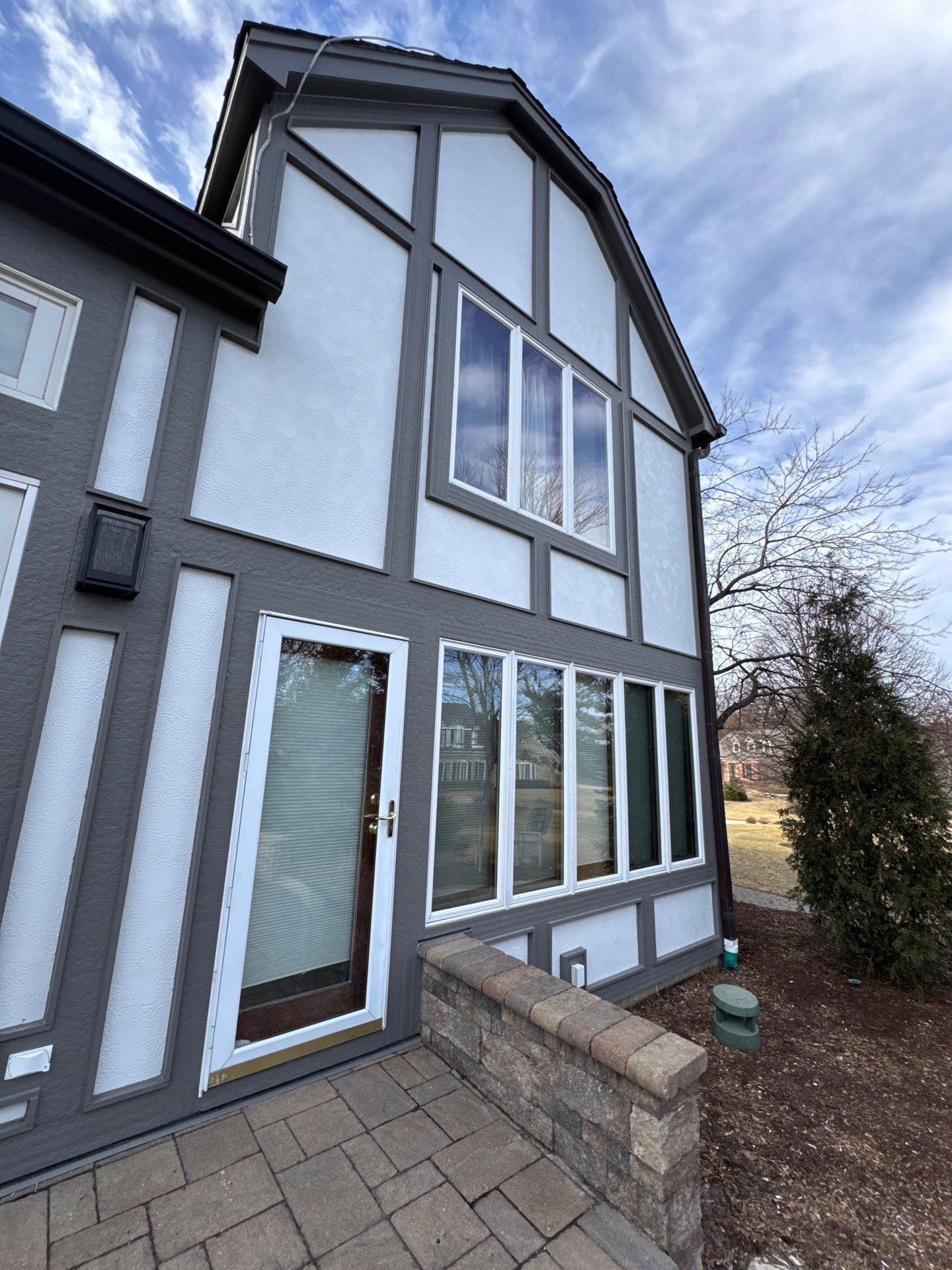 A large house with a lot of windows and doors