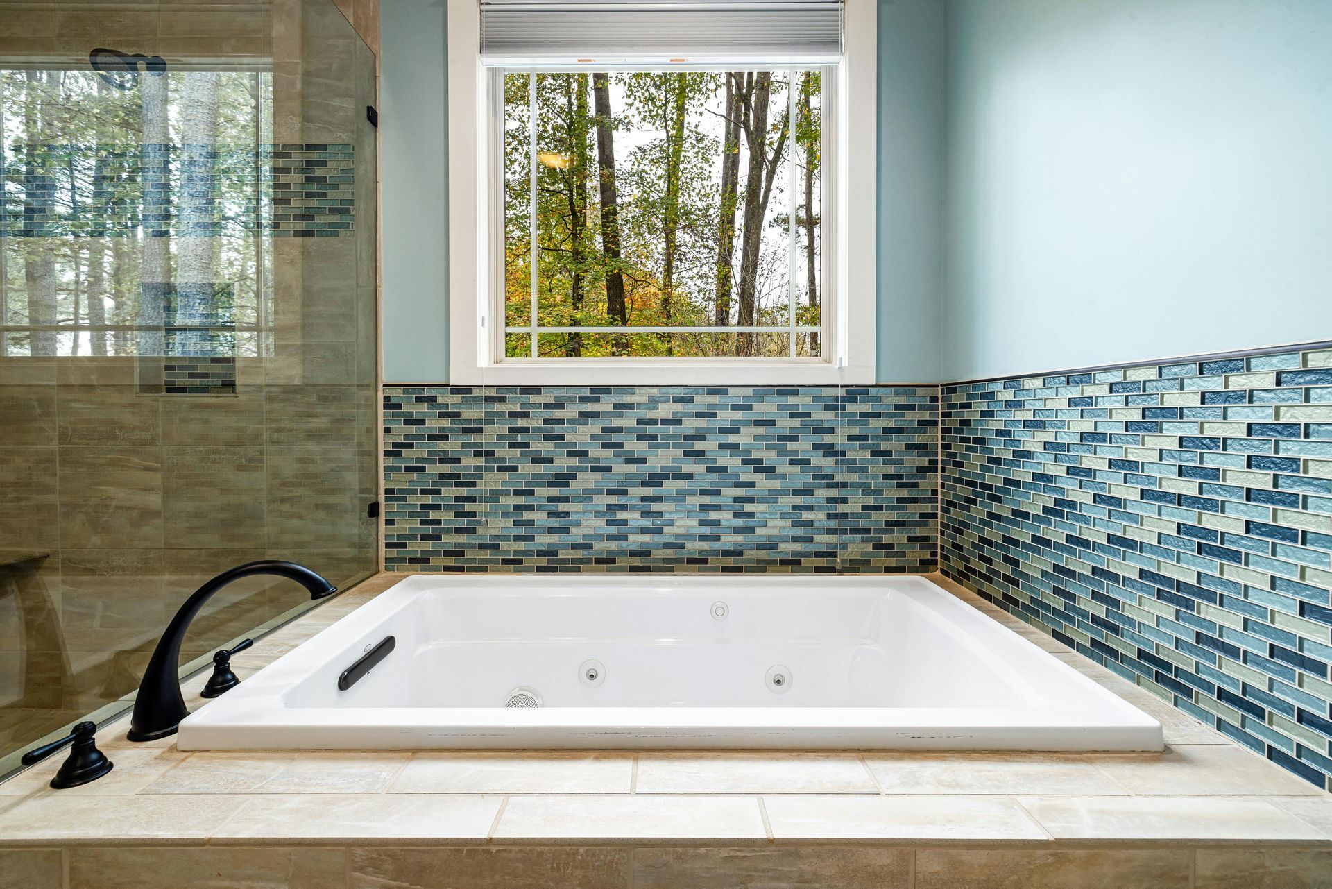 Pro maintained hot tub with decorative tile work showing quality residential hot tub service