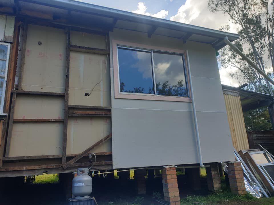 House With A Window On The Side For Home Renovation — McCarthys Property Services in Maclean, NSW