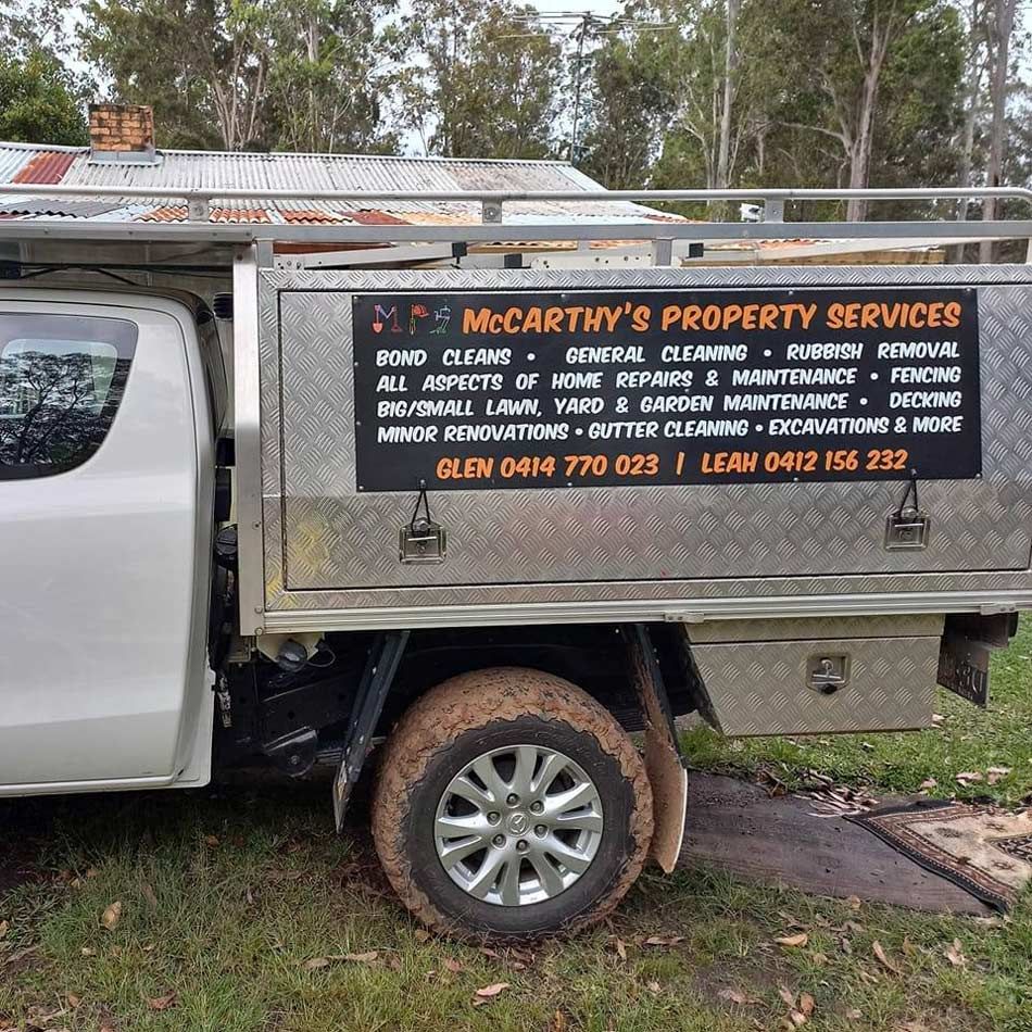 A White Truck With A Sign On The Back That Says Mccarthy 's Property Services — McCarthys Property Services in Glenugie, NSW