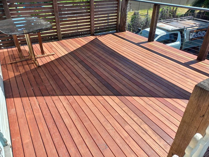 A Wooden Deck With A Table And Chairs After A Wooden Deck With A Table And Chairs Before — McCarthys Property Services in Glenugie, NSW