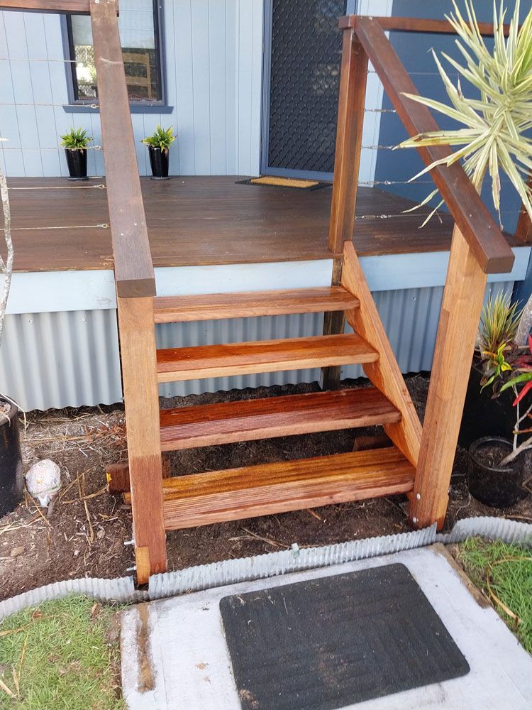 A Set Of Wooden Stairs Leading Up To A Deck Before — McCarthys Property Services in Glenugie, NSW
