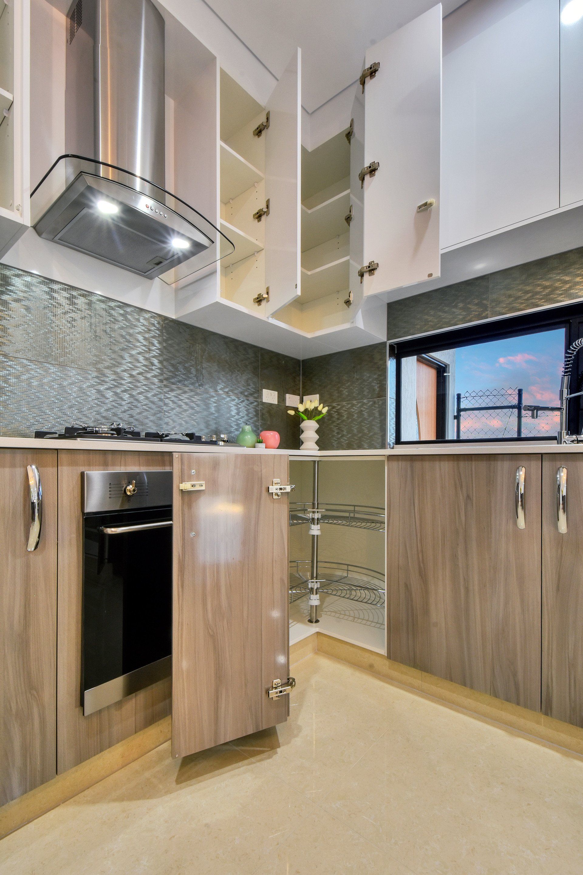 A kitchen with stainless steel appliances and wooden cabinets