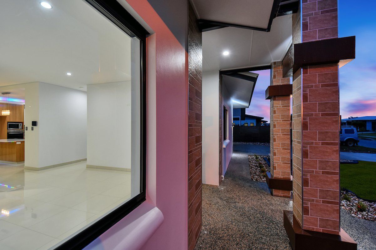 A view of a house through a window at night.