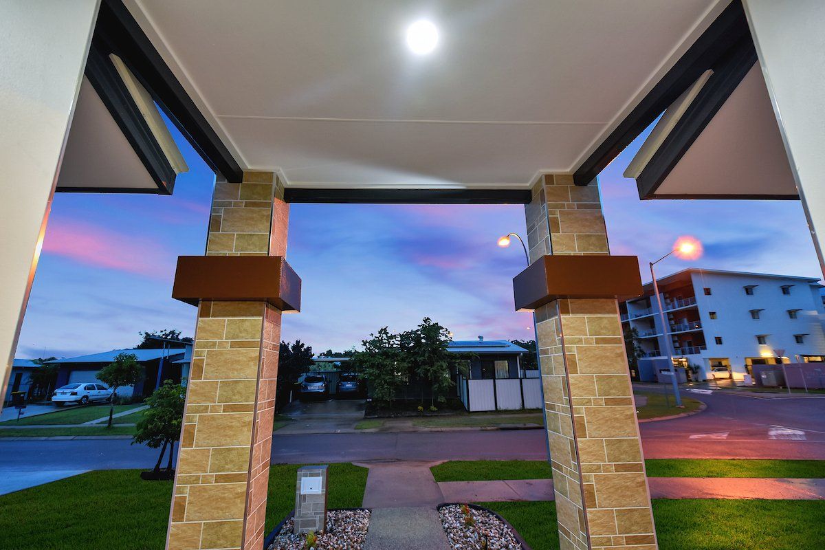 A view of a house from a porch at night