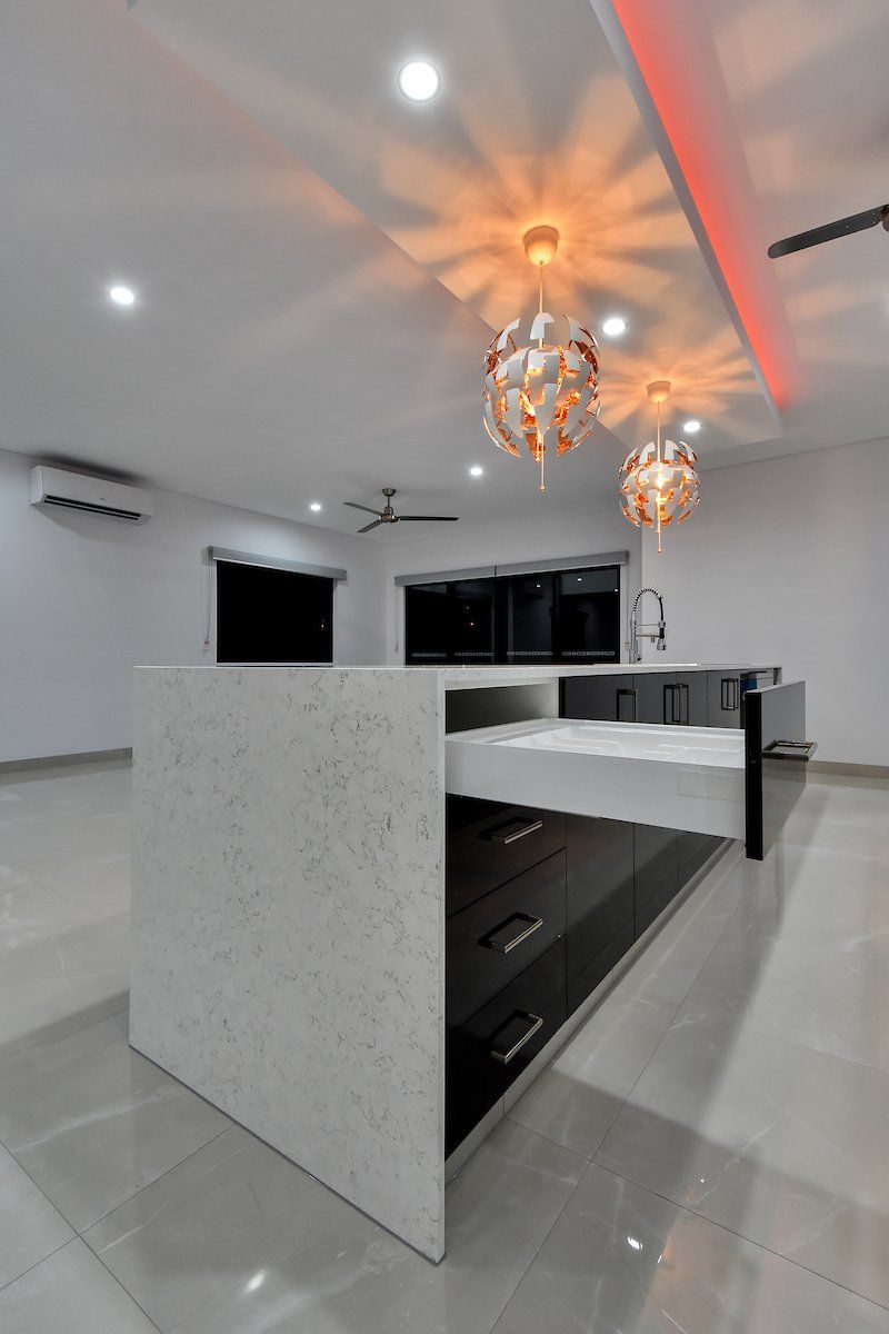 A kitchen with a large island in the middle of the room