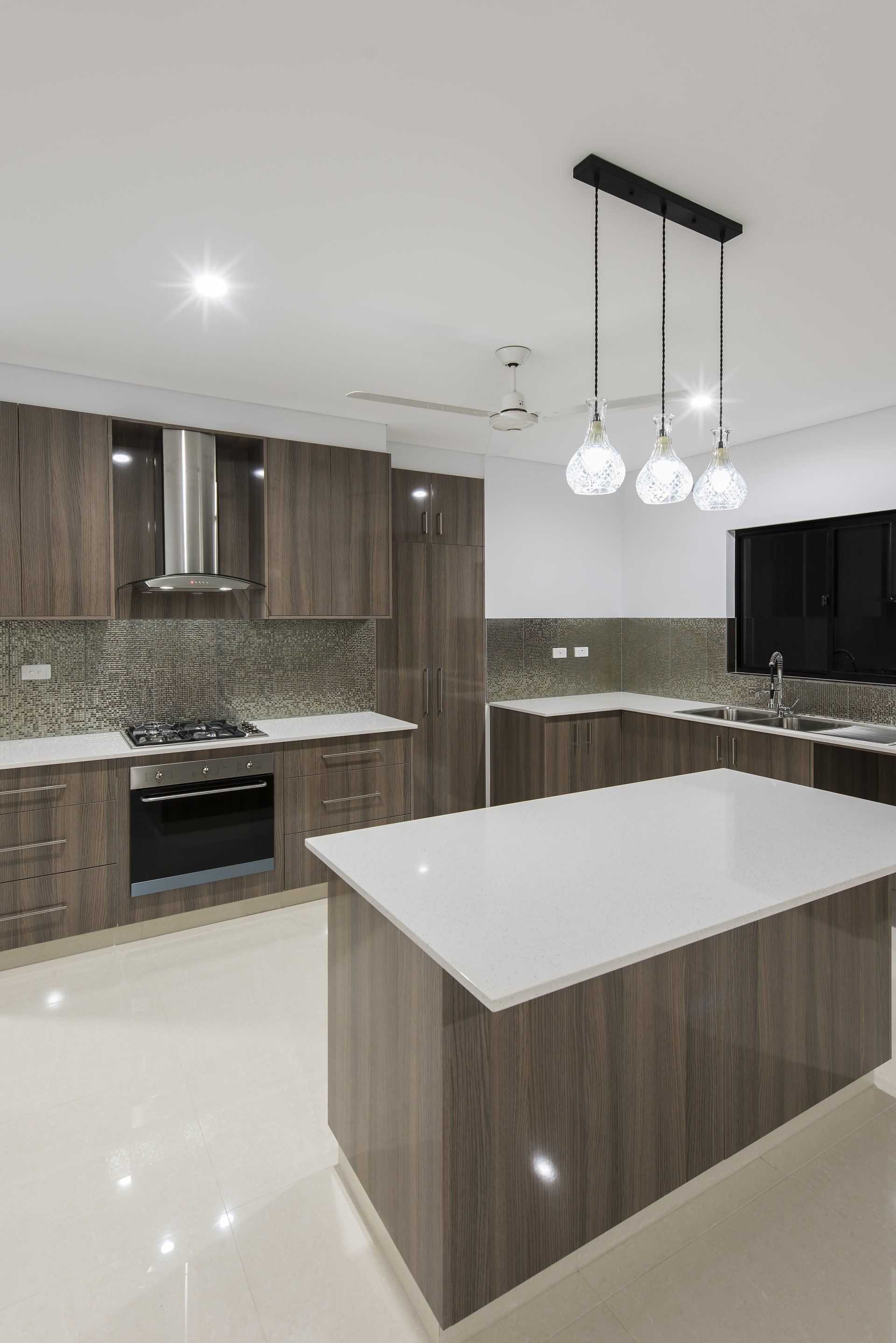 There is a large island in the middle of the kitchen.