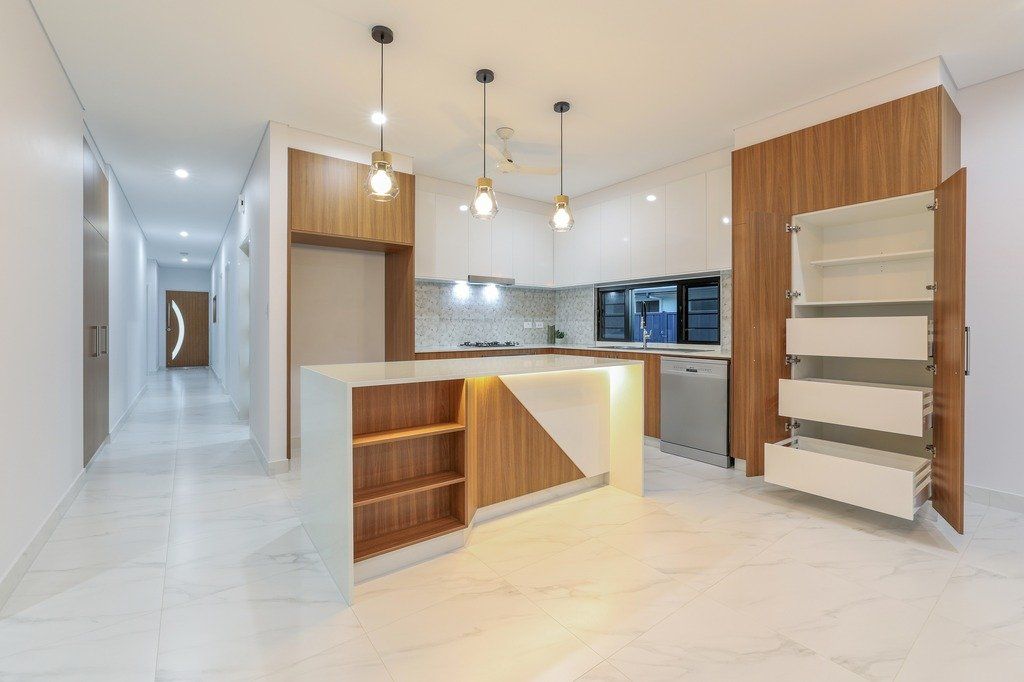 A kitchen with a large island in the middle of the room.