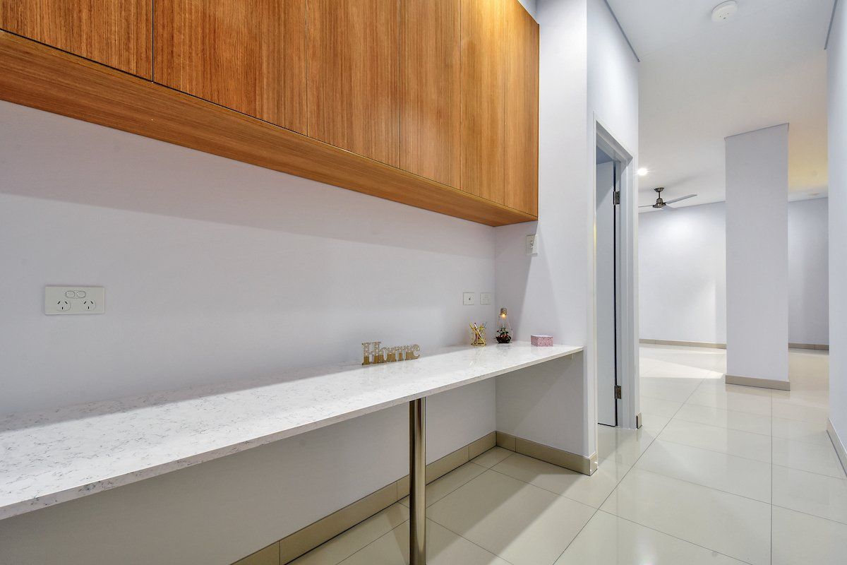 There is a long table in the middle of the room.