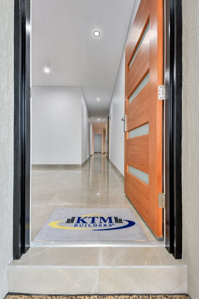 A doorway with a mat that says ktm on it