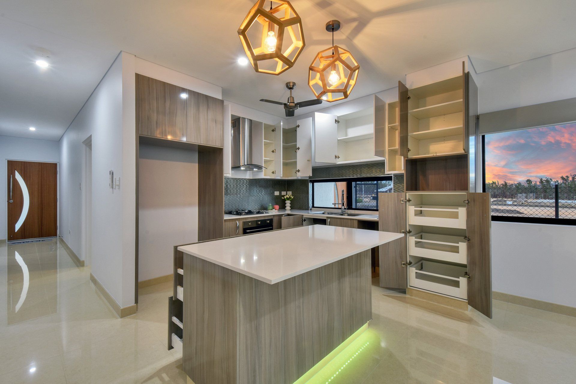 A kitchen with a large island in the middle of it.