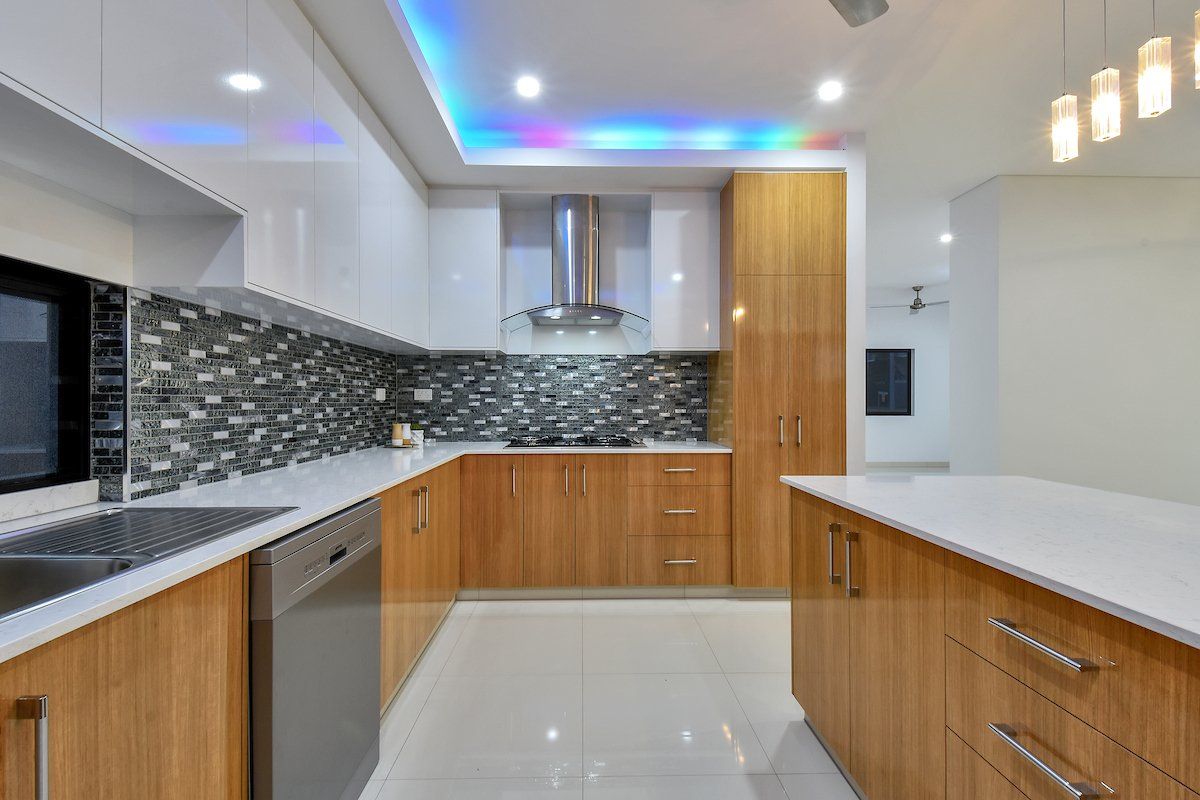 A kitchen with wooden cabinets and stainless steel appliances