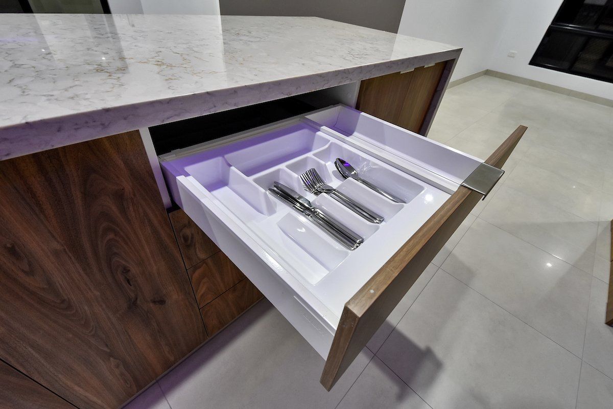 A kitchen drawer filled with silverware and utensils