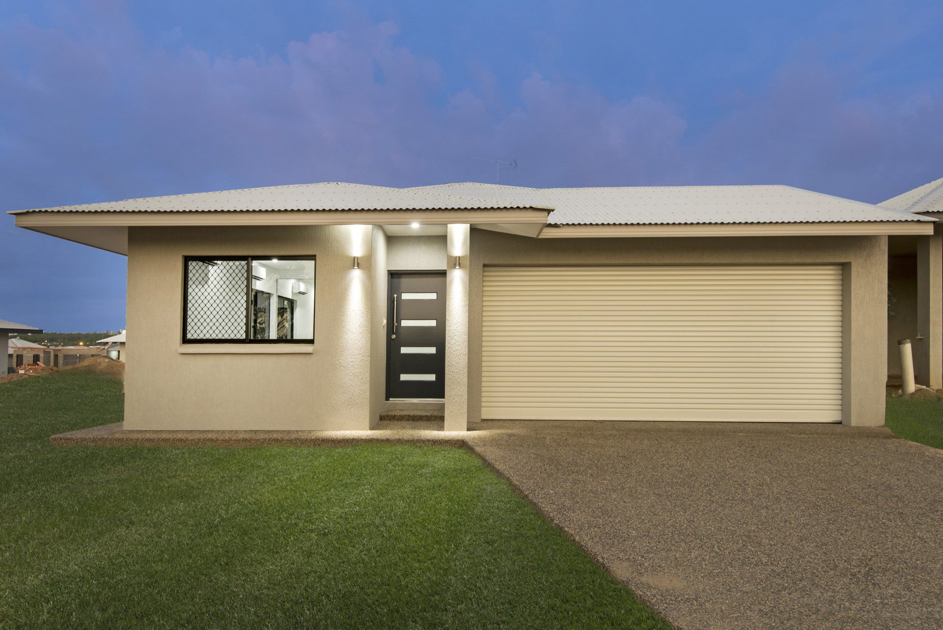 The front of a house with a garage and a driveway.