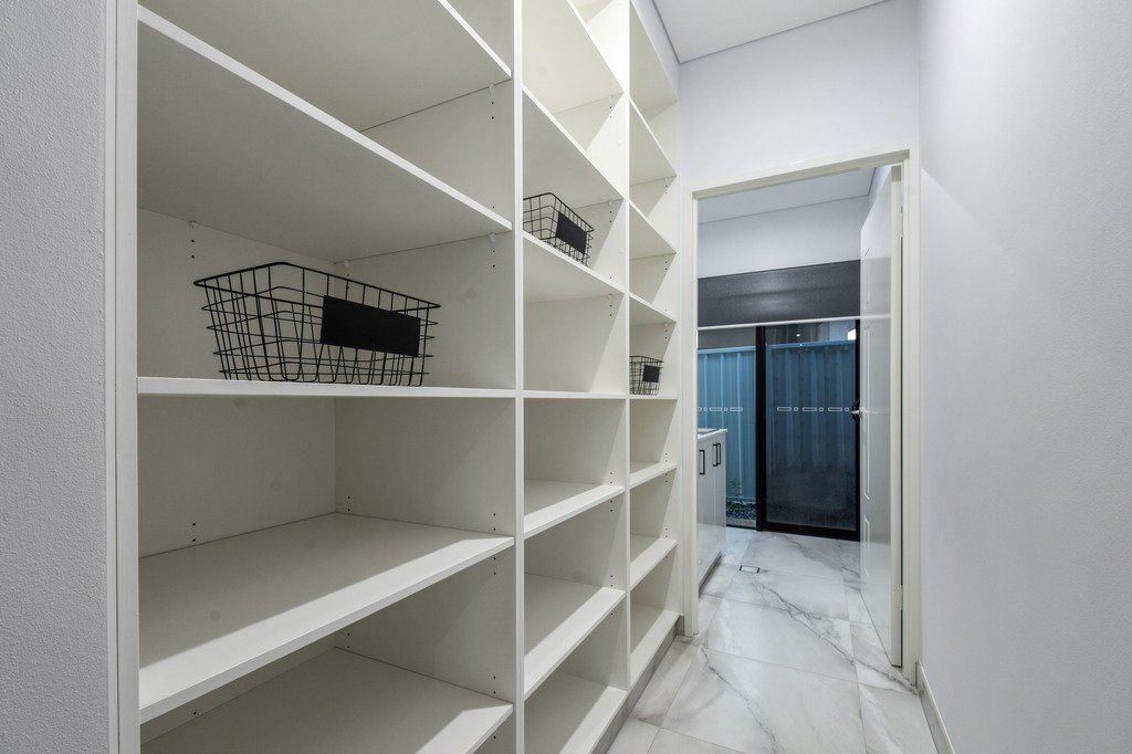 There are a lot of shelves in this walk in closet.