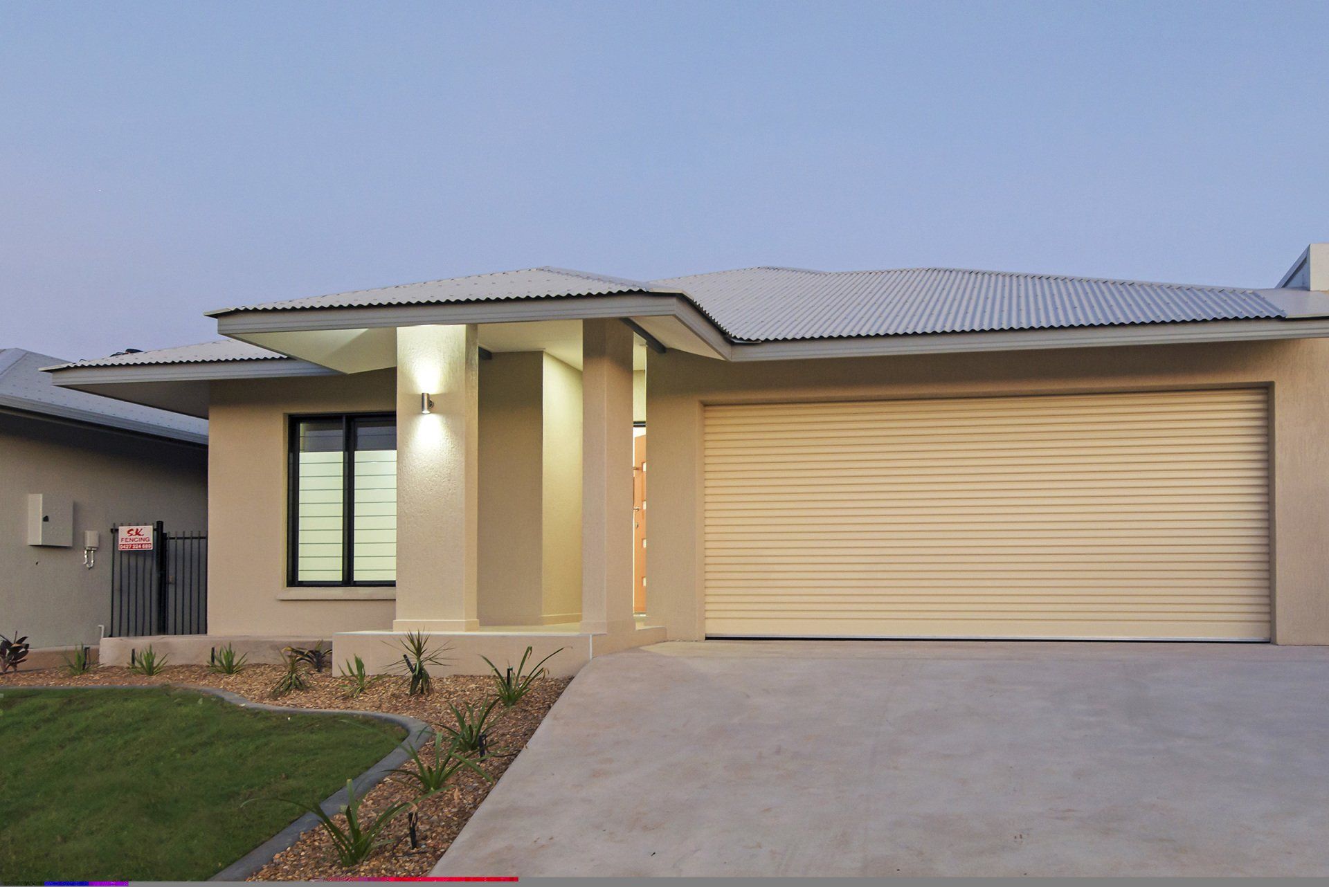 The front of a house with a large garage door