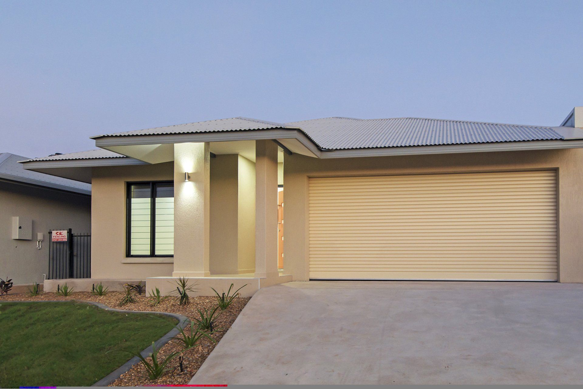 The front of a house with a large garage door