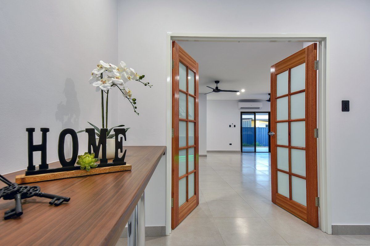 A wooden table with a sign that says home on it