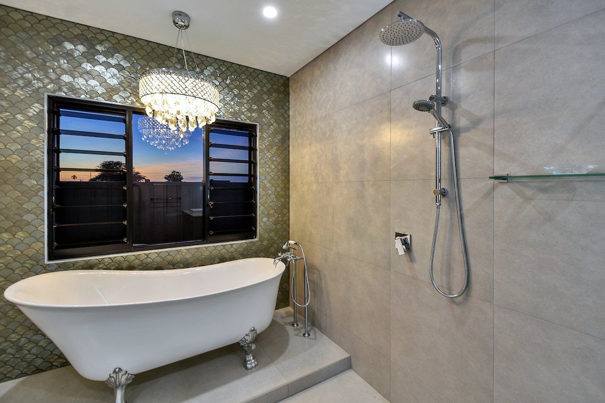 A bathroom with a claw foot tub and a shower