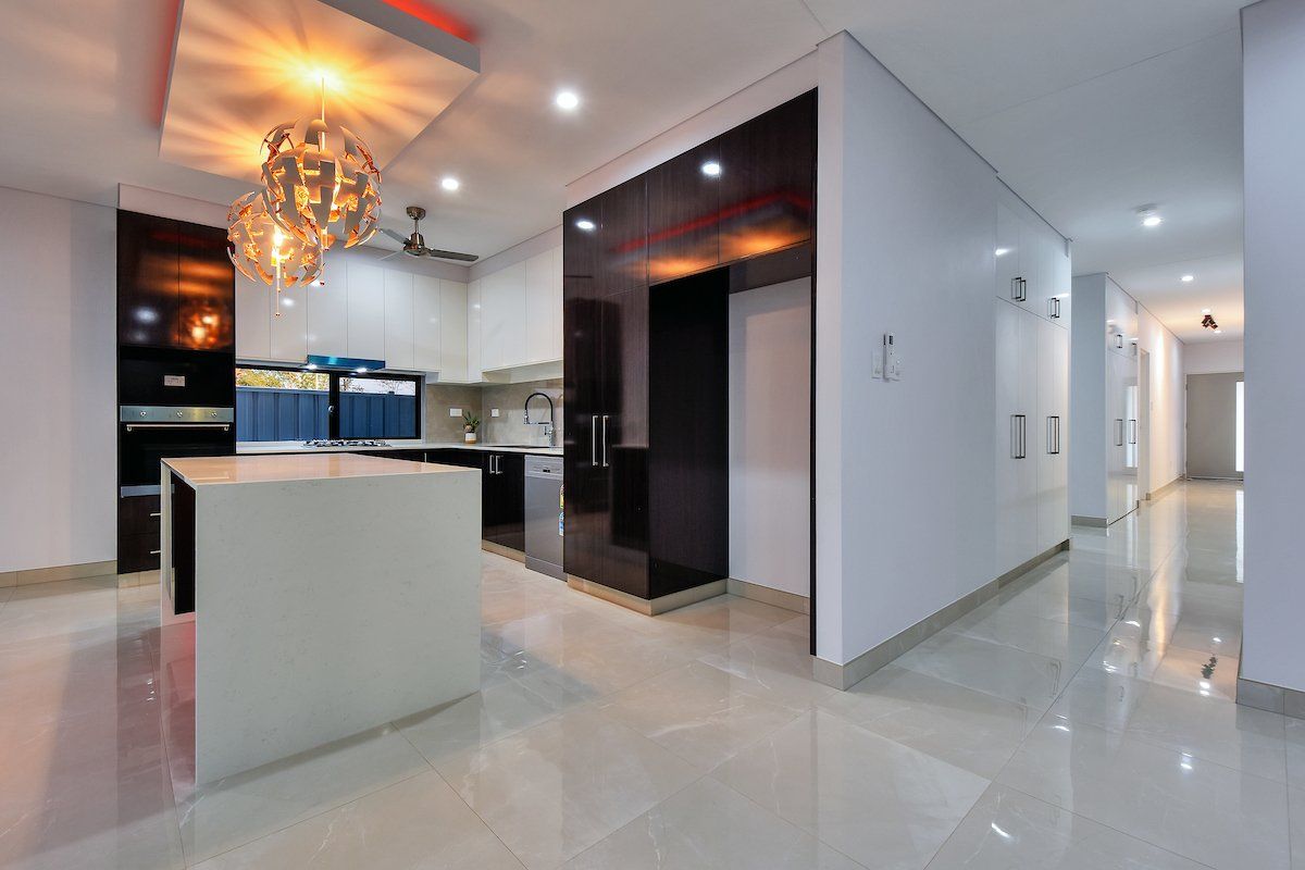 A kitchen with a large island in the middle of the room.