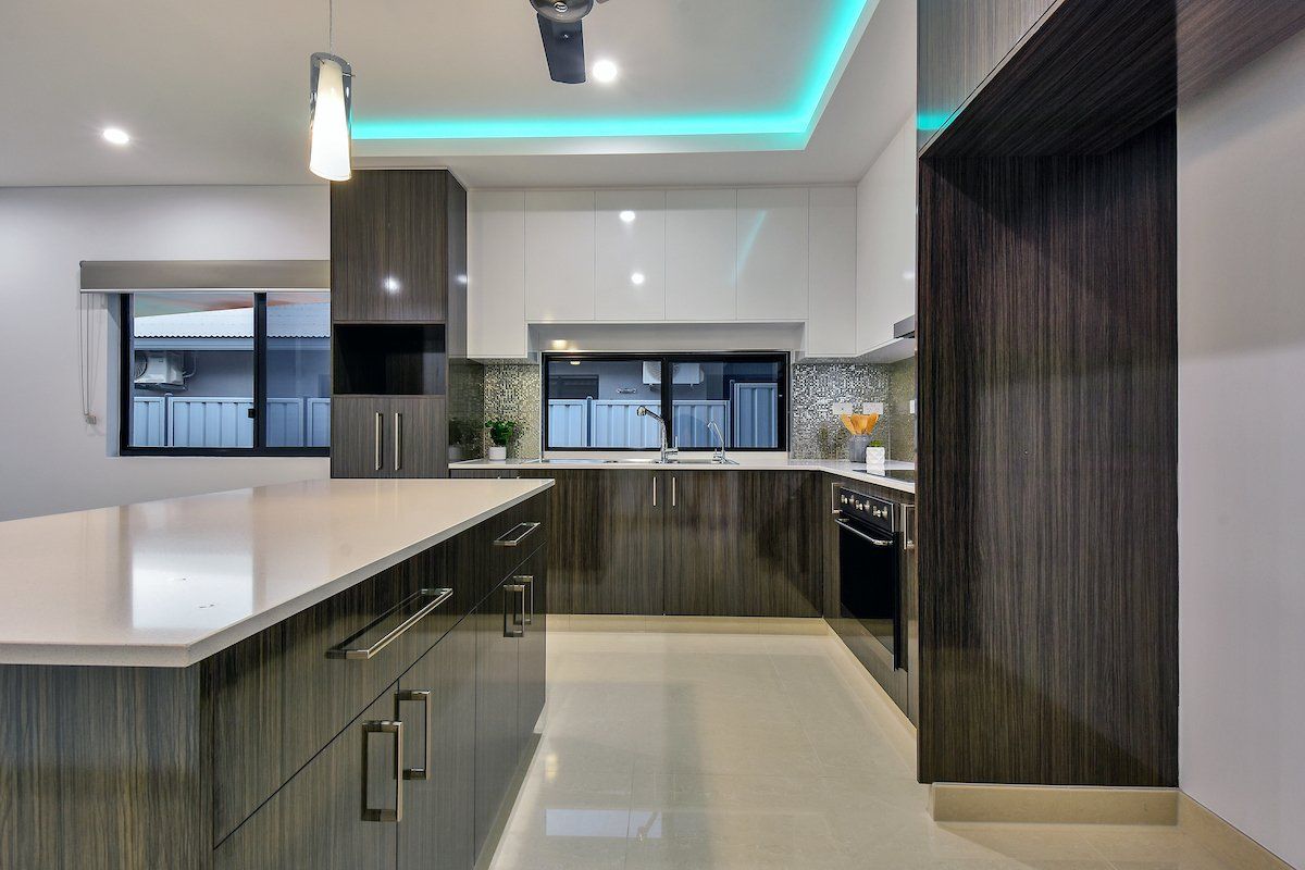 A kitchen with a large island in the middle of it