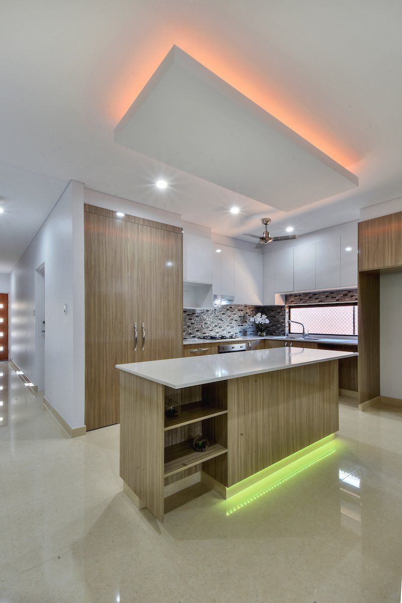 A kitchen with a large island in the middle of it