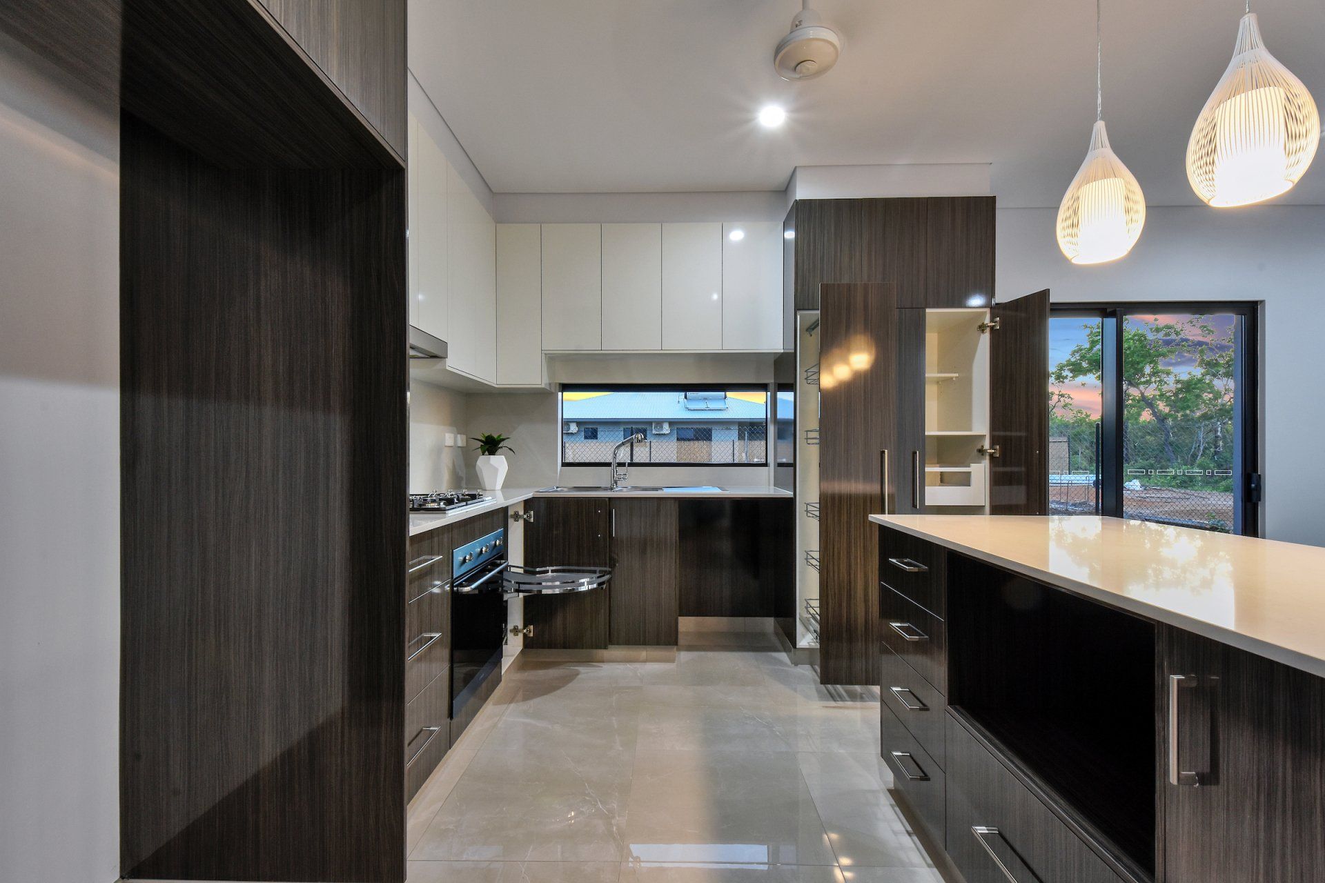 A kitchen with stainless steel appliances and wooden cabinets