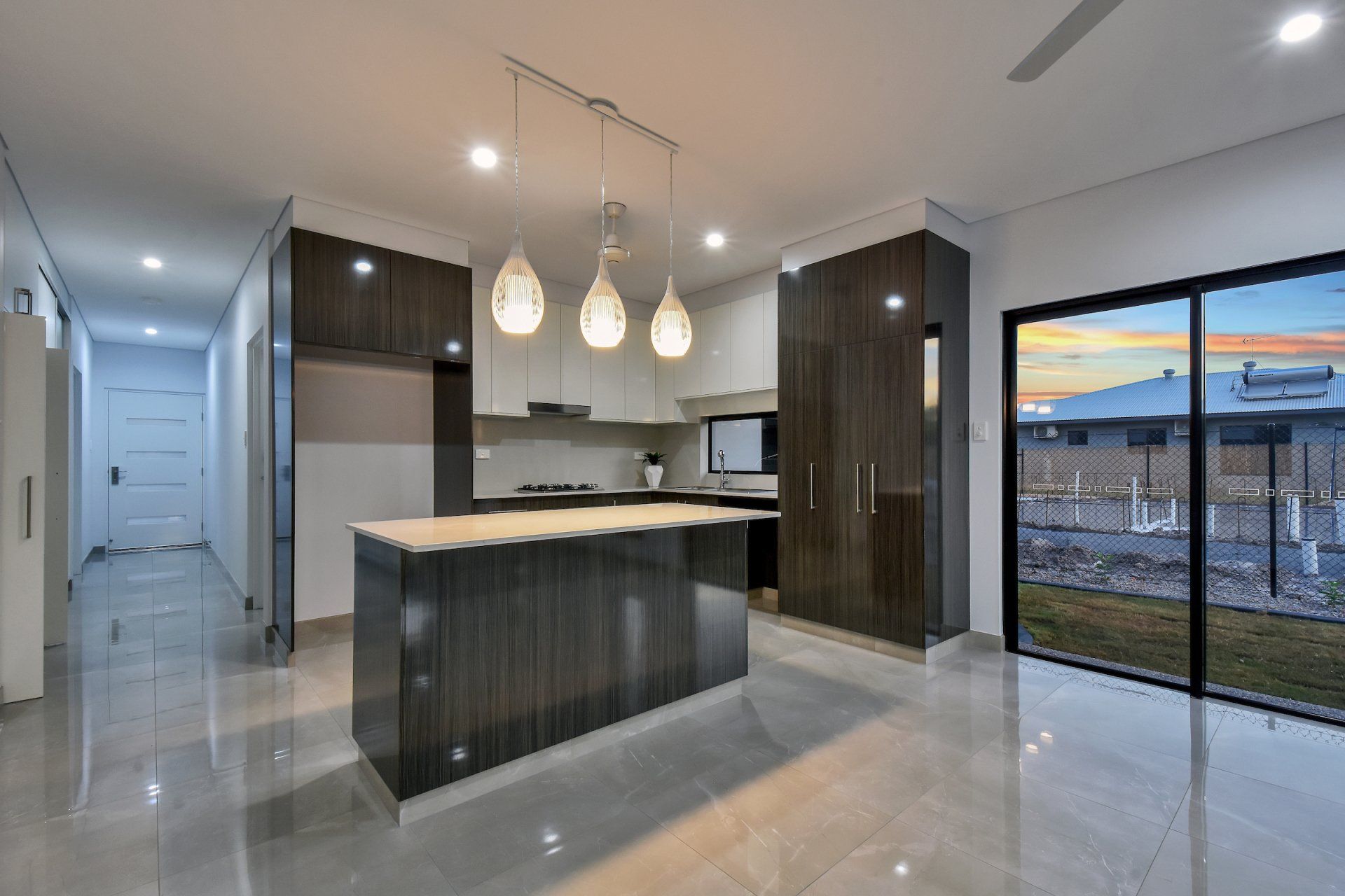 There is a large island in the middle of the kitchen.