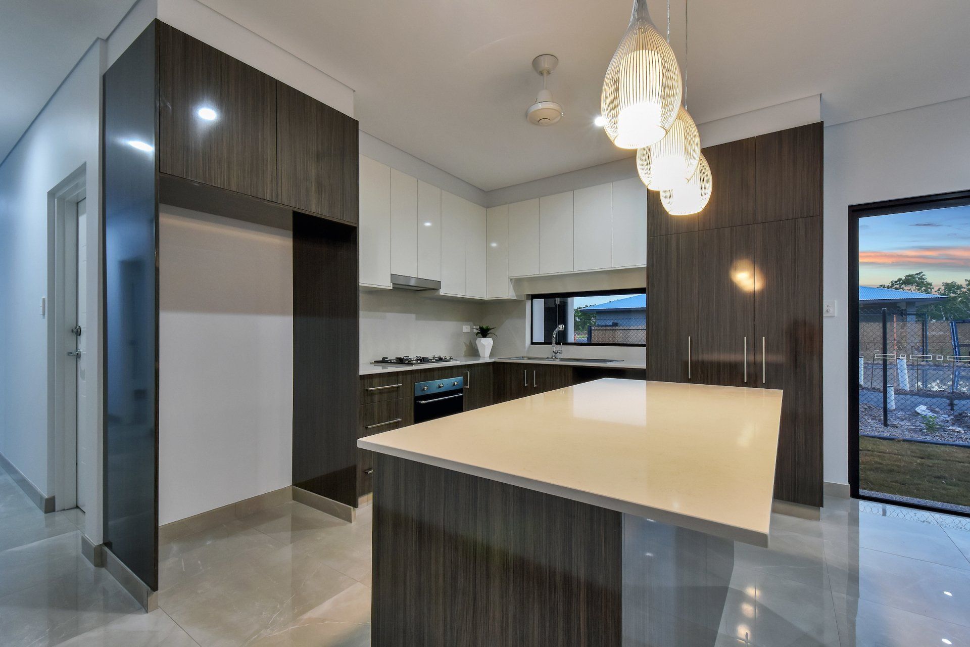 A kitchen with a large island in the middle of it.