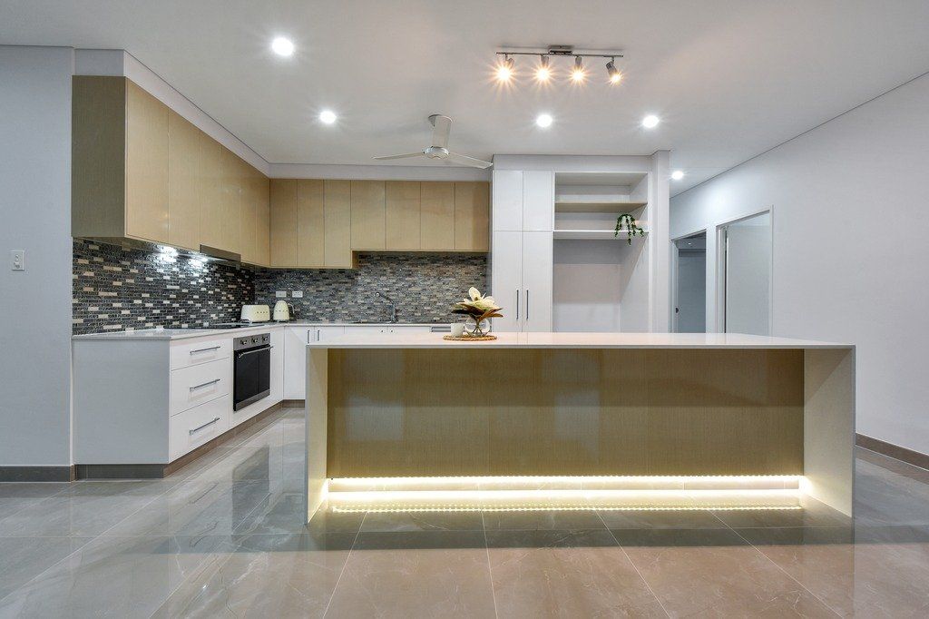 There is a large island in the middle of the kitchen.