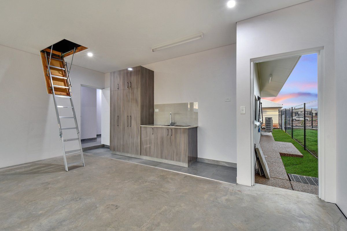 There is a ladder in the ceiling of the room.