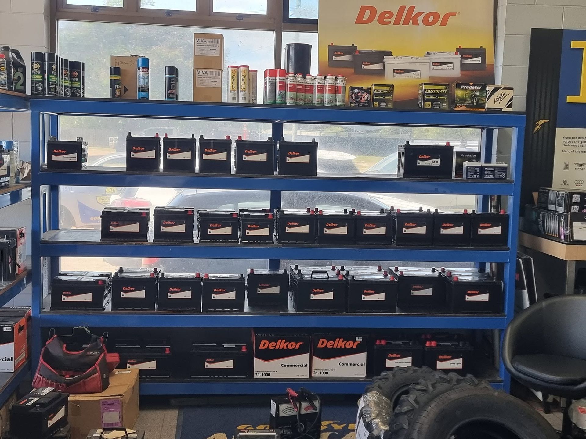 Auto Parts Store Display of Delkor Batteries on Blue Metal Shelves — Goodyear Autocare Bowen in Bowen, QLD