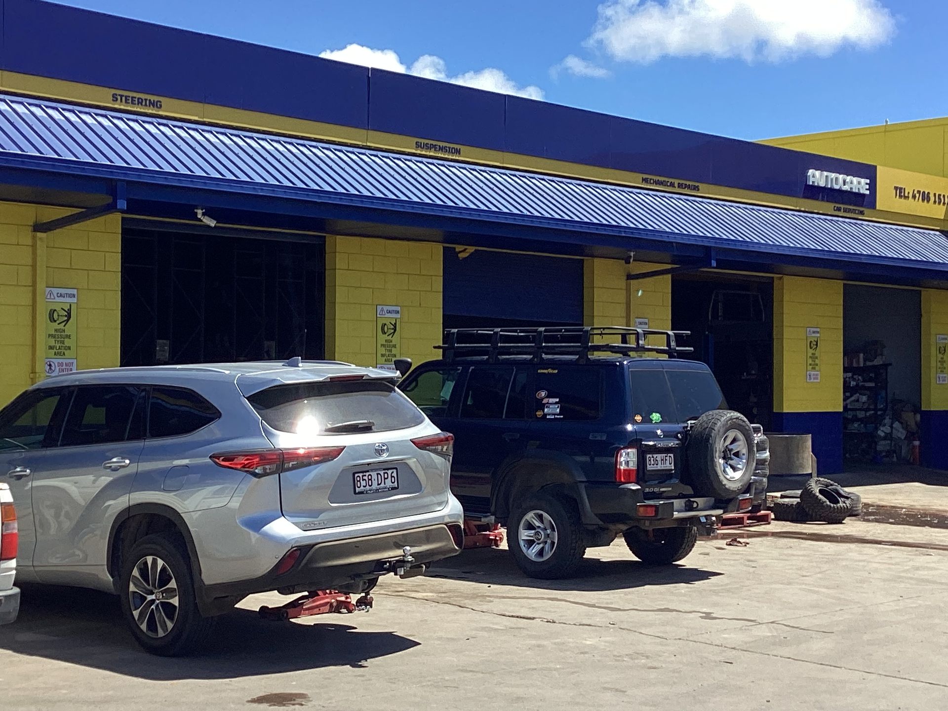 A Person Is Fixing A Brake Disc On A Car — Goodyear Autocare Bowen in Bowen, QLD