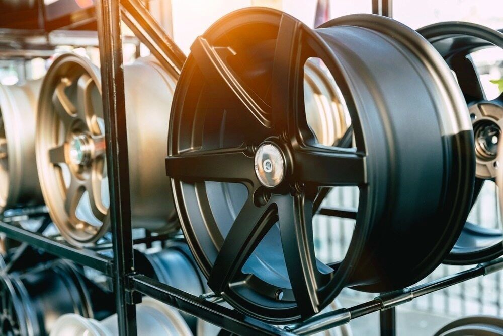 A Bunch Of Wheels Are Stacked On Top Of Each Other On A Rack — Goodyear Autocare Bowen in Bowen, QLD
